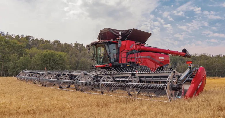 Case AF11 combine in a harvested field